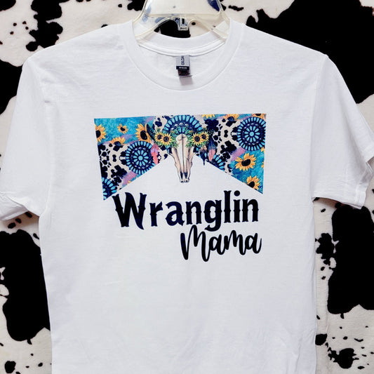 White t-shirt with 'Wranglin' Mama' text and floral design on a black and white patterned background