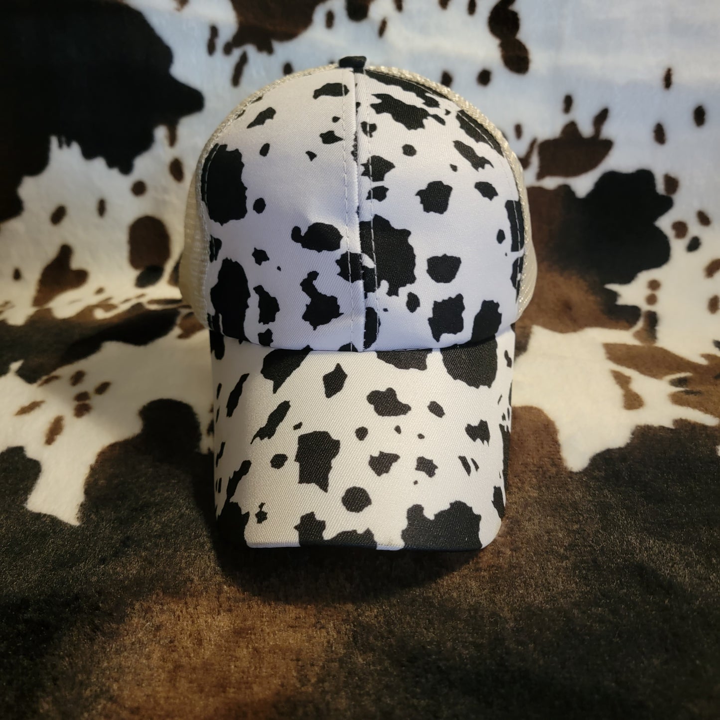 White Cow Print Criss Cross Ponytail Hat