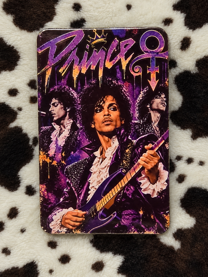 Prince purple guitar collage refrigerator magnet with rounded corners on a cow-print blanket